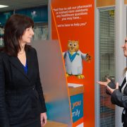 rowlands pharmacy area manager beth talking to lesley griffiths in rowlands wrexham