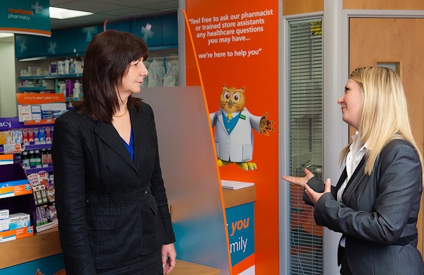 rowlands pharmacy area manager beth talking to lesley griffiths in rowlands wrexham