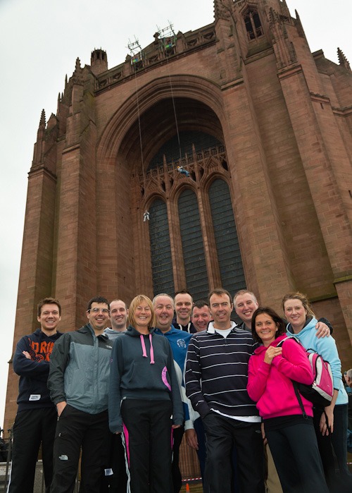 Rowland--liverpool-cathedral-2-Edit staff from rowlands pharmacy stand in front of liverpool cathedral before abseil