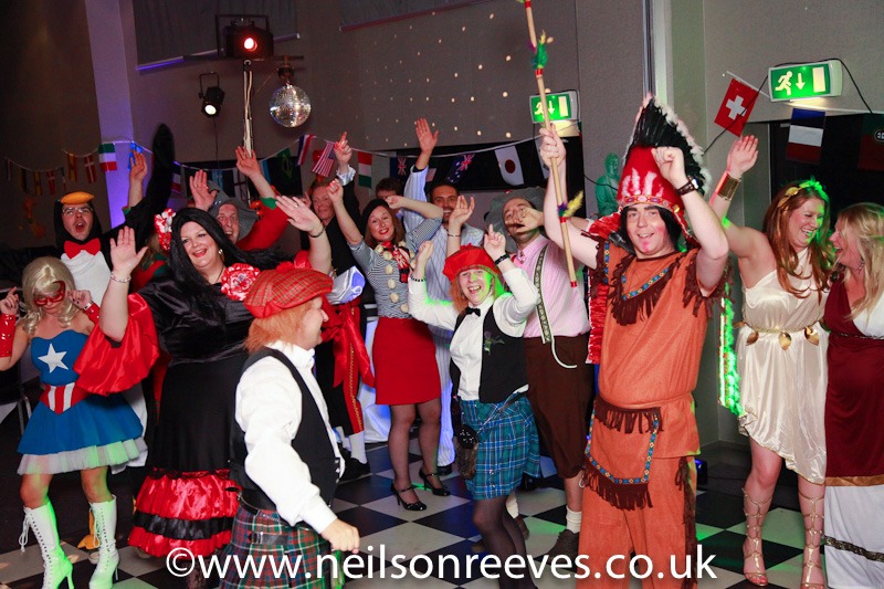 people dancing in fancy dress at the crown plazza manchester