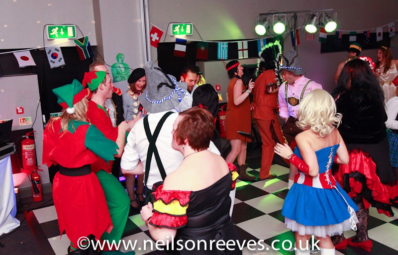 people dancing in fancy dress at the crown plazza manchester