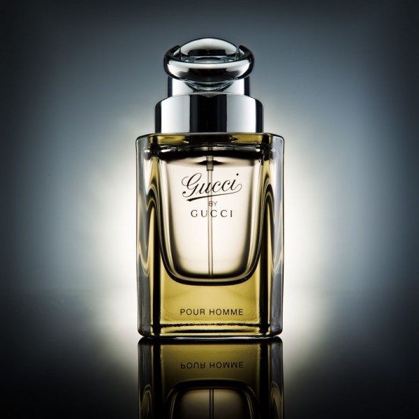 Product photography hero shot of gucci bottle