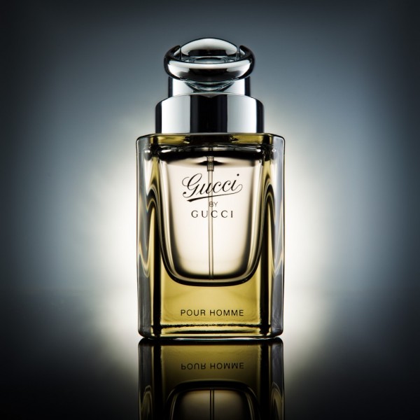 Product photography hero shot of gucci bottle