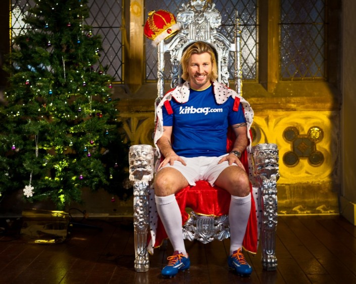 Robbie Savage dressed as the queen on a throne