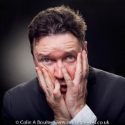 Portrait featuring Ian pulestion-davies with hands on face in a pained expression