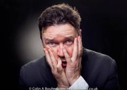 Portrait featuring Ian pulestion-davies with hands on face in a pained expression