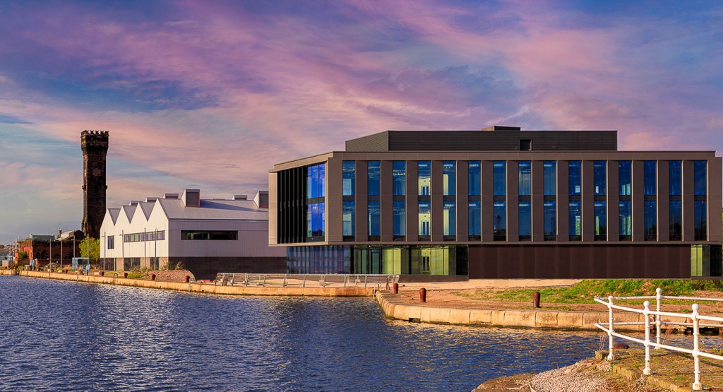 The Hive Wirral waters with water in front and dramatic sky