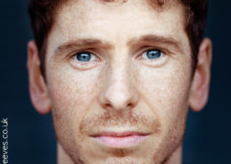 close crop actor headshot featuring actor Gerard kearns with freckles and stunning blue eyes