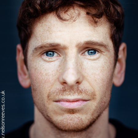 close crop actor headshot featuring actor Gerard kearns with freckles and stunning blue eyes