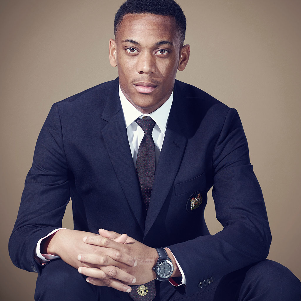 Mix race young man blue suit brown tie and brown background