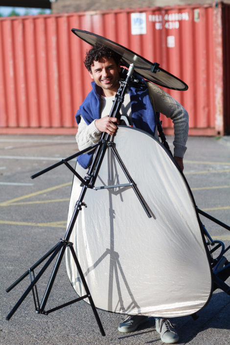 Actor Ryan Thomas overloaded with photography gear he is kindly carrying