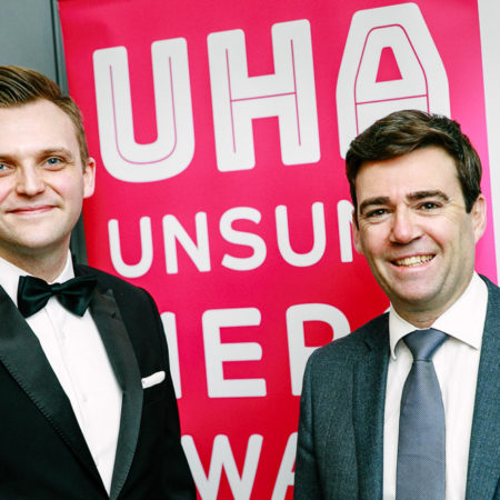 Andy Burnham and Mark Cherry UHA awards banner
