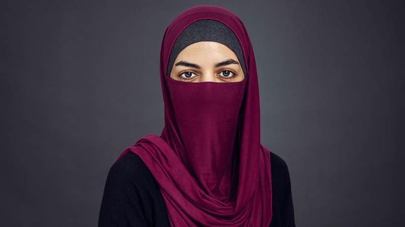 Corporate headshots try background featuring Muslim woman with ice covering